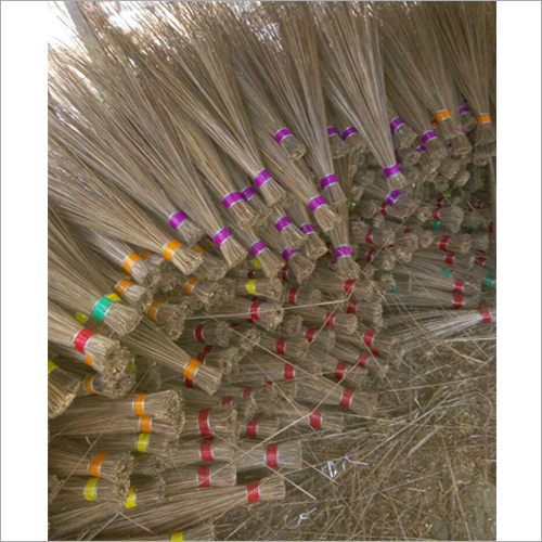 Finished grass brooms bundled and ready